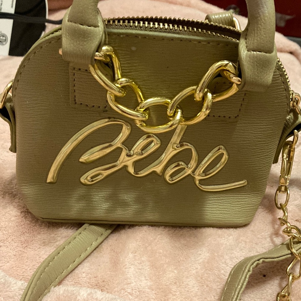 Tan Bebe purse small for when you don’t have much to carry.